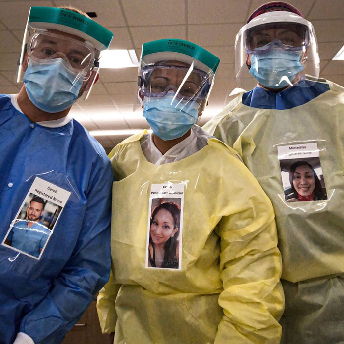 Healthcare workers with a smiley-faced picture.